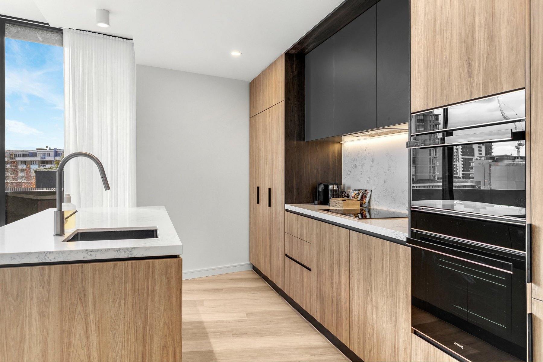 Modern kitchen in managed Newcastle short-stay apartment